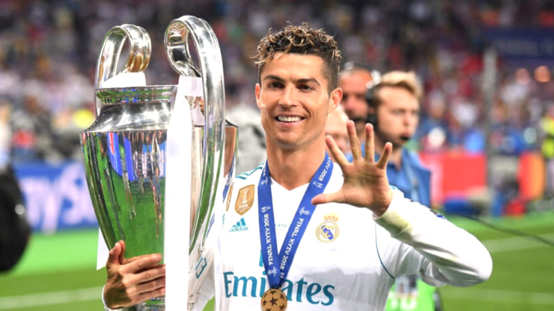Cristiano ronaldo in Real madrid with trophy