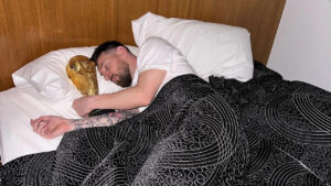 Messi sleeping with world cup trophy