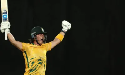 Dewald Brevis raises his arms after reaching a hundred