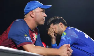 Afghanistan coach Jonathan Trott and disappointed Rashid Khan