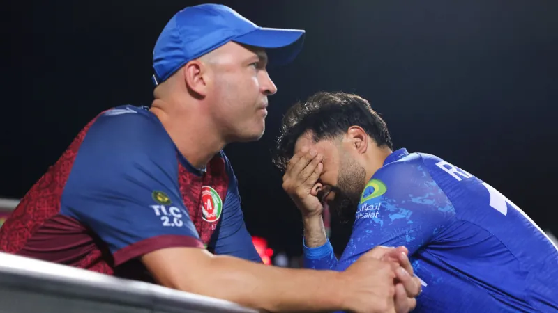 Afghanistan coach Jonathan Trott and disappointed Rashid Khan