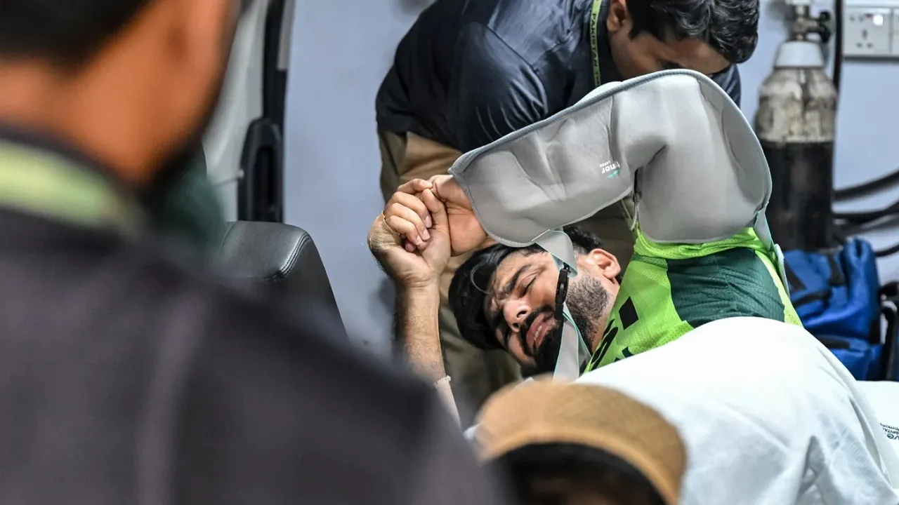 Hussain Talat is stretchered off the ground after picking up an injury against Bangladesh