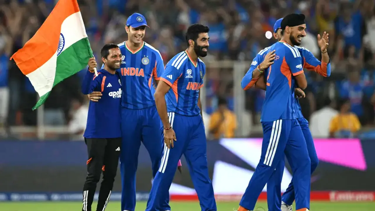 The India team celebrates winning the World Cup
